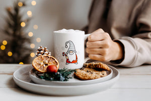 White mug with Gnome holding a Candy